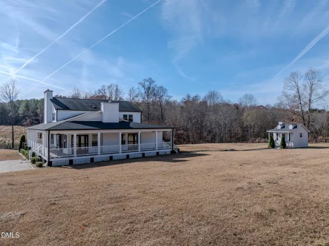 a view of swimming pool in front of residential houses