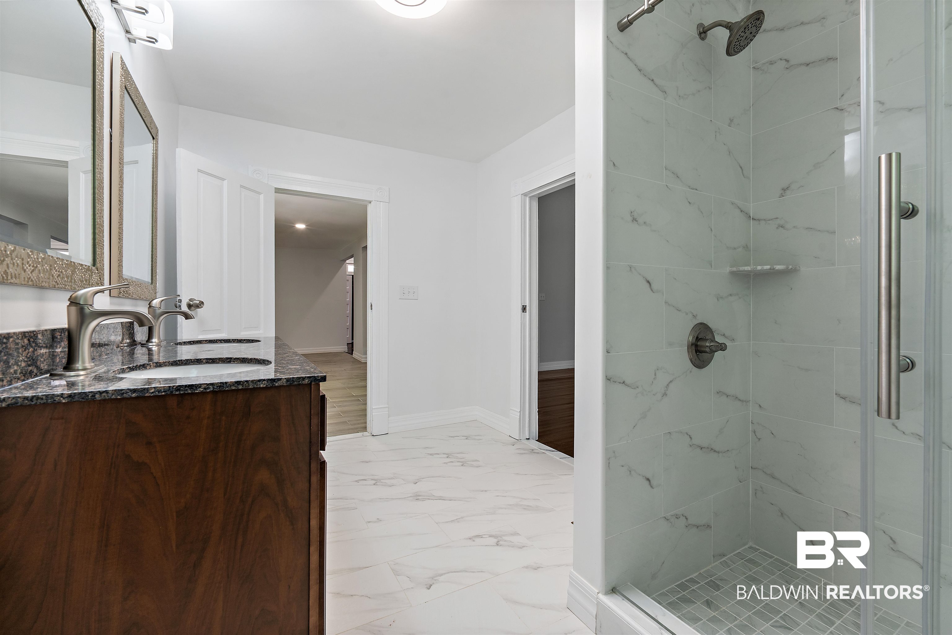 407 East 2nd Street Bay Minette, AL 36507 - Photo 31 of 40 Bathroom featuring a marble finish shower, double vanity, and light marble finish flooring
