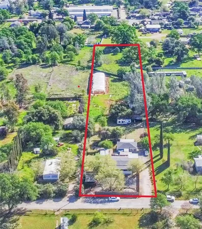a view of street with wooden fence
