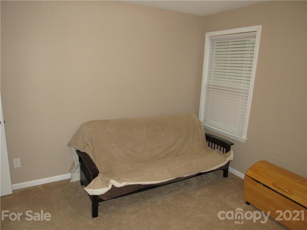 8188 Thornton Street Locust, NC 28097 - Photo 11 of 36 a view of a room with a bench