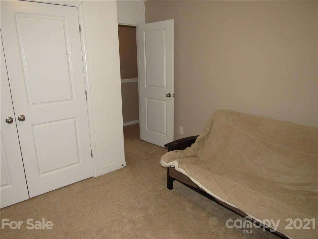 8188 Thornton Street Locust, NC 28097 - Photo 12 of 36 a room with a table and a closet