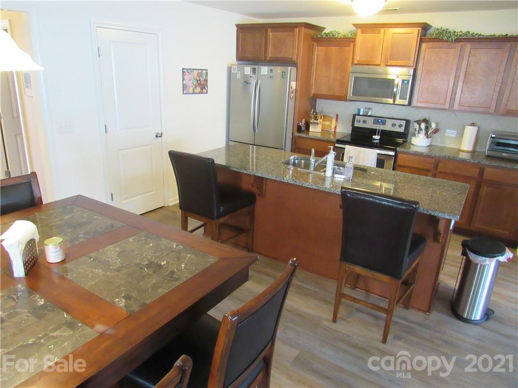 8188 Thornton Street Locust, NC 28097 - Photo 19 of 36 a view of a dining room with furniture