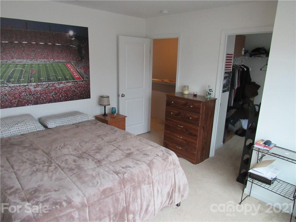 8188 Thornton Street Locust, NC 28097 - Photo 22 of 36 a bedroom with a bed and a television
