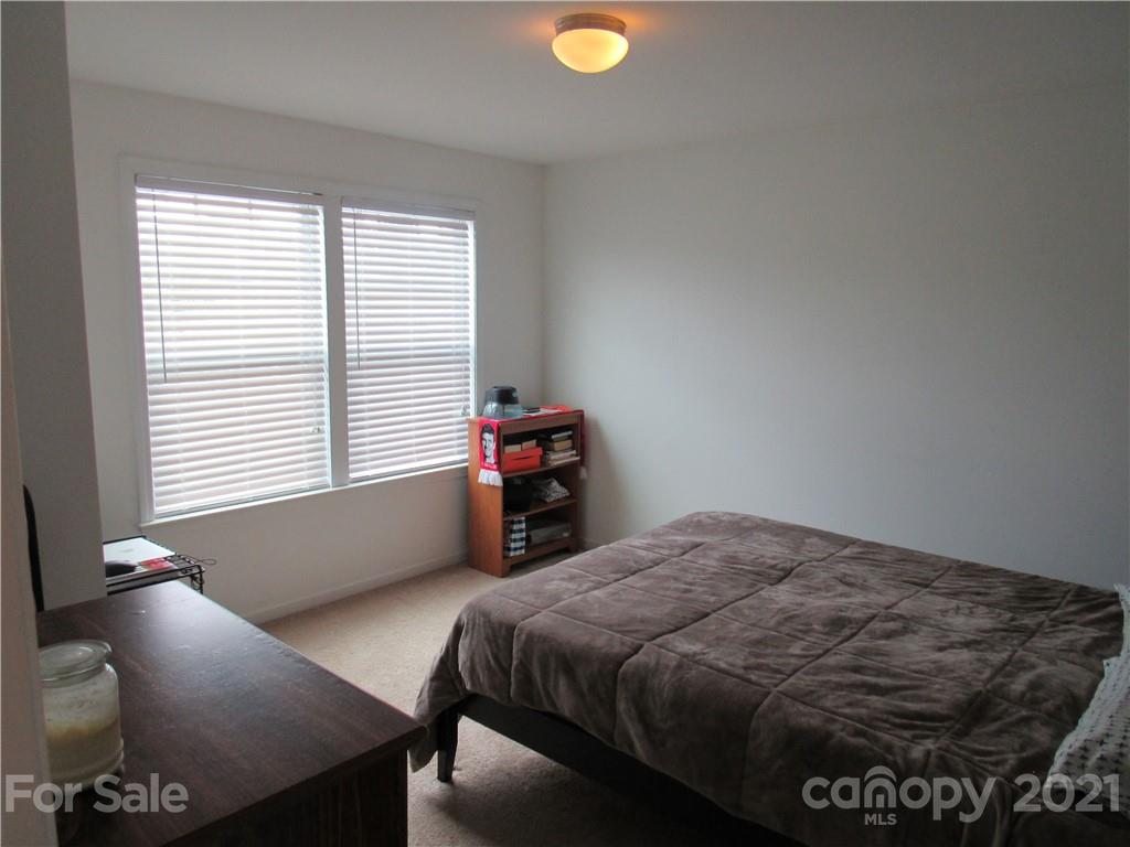 8188 Thornton Street Locust, NC 28097 - Photo 23 of 36 a bedroom with a bed and a window