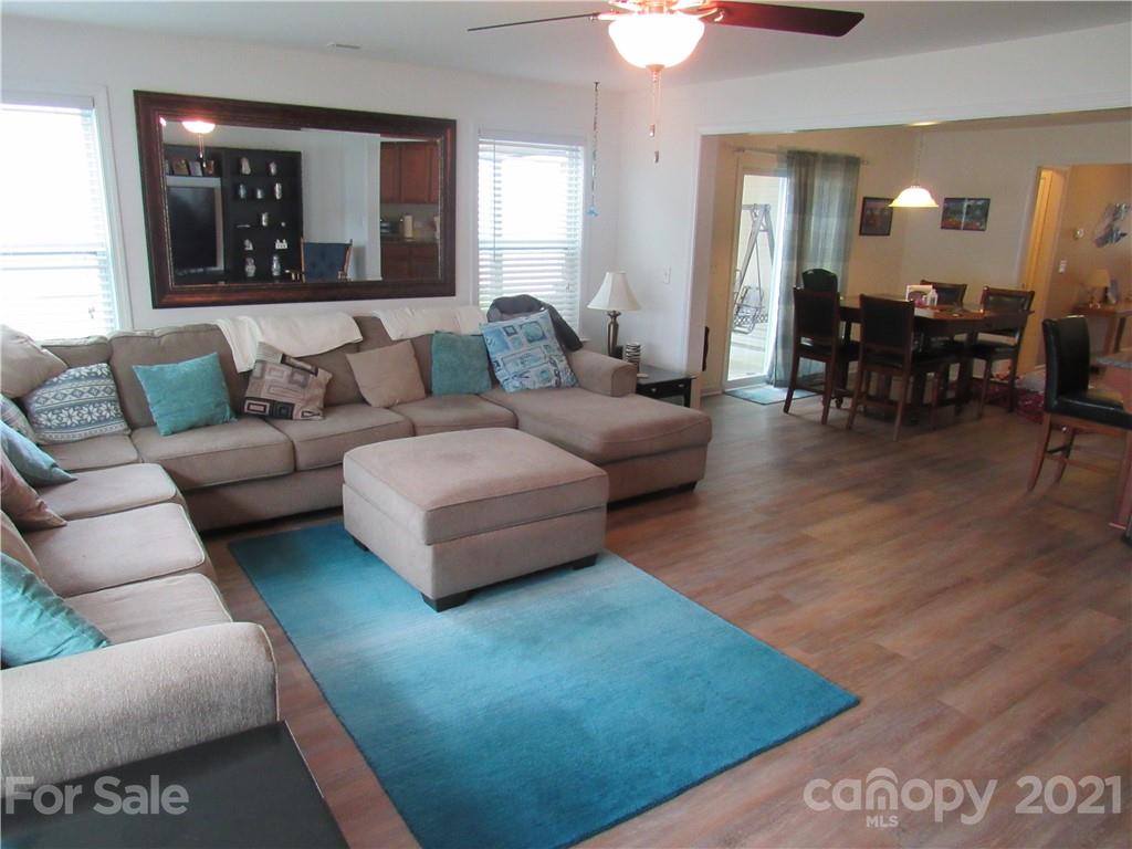 8188 Thornton Street Locust, NC 28097 - Photo 24 of 36 a living room with furniture and wooden floor