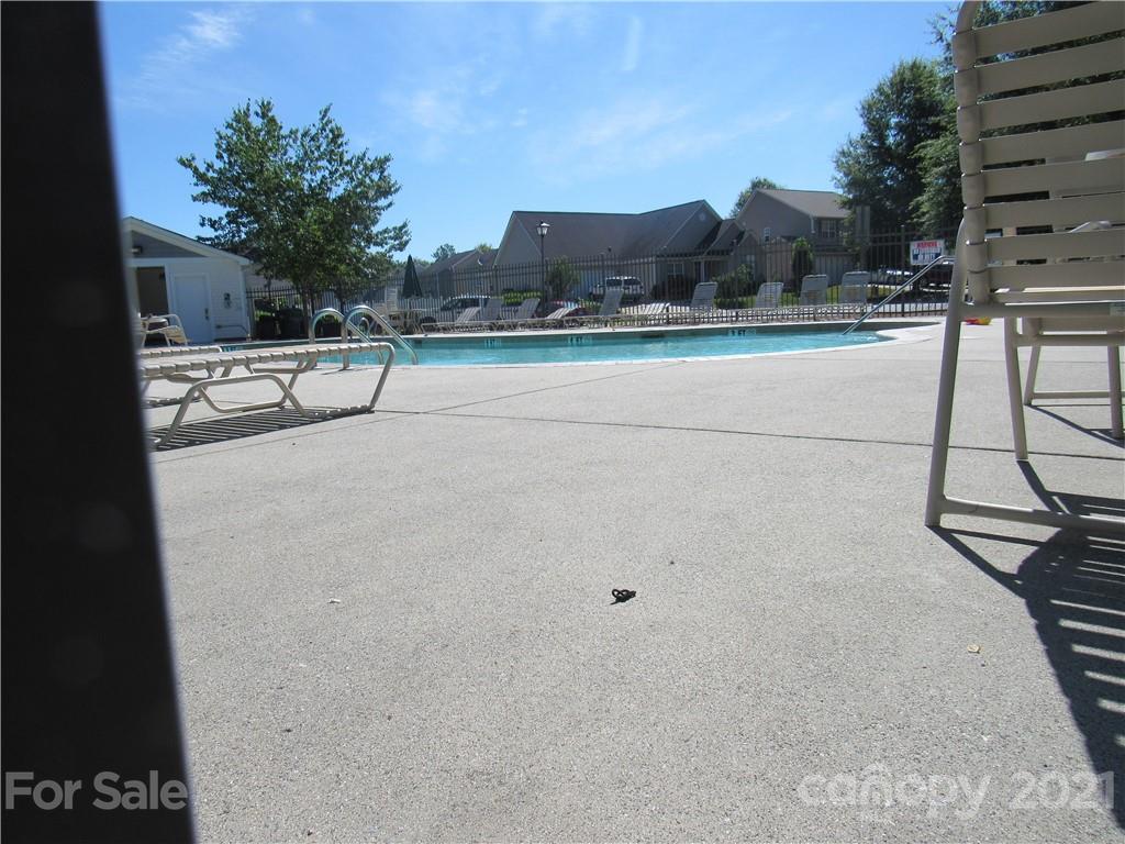 8188 Thornton Street Locust, NC 28097 - Photo 34 of 36 a view of a swimming pool and a yard