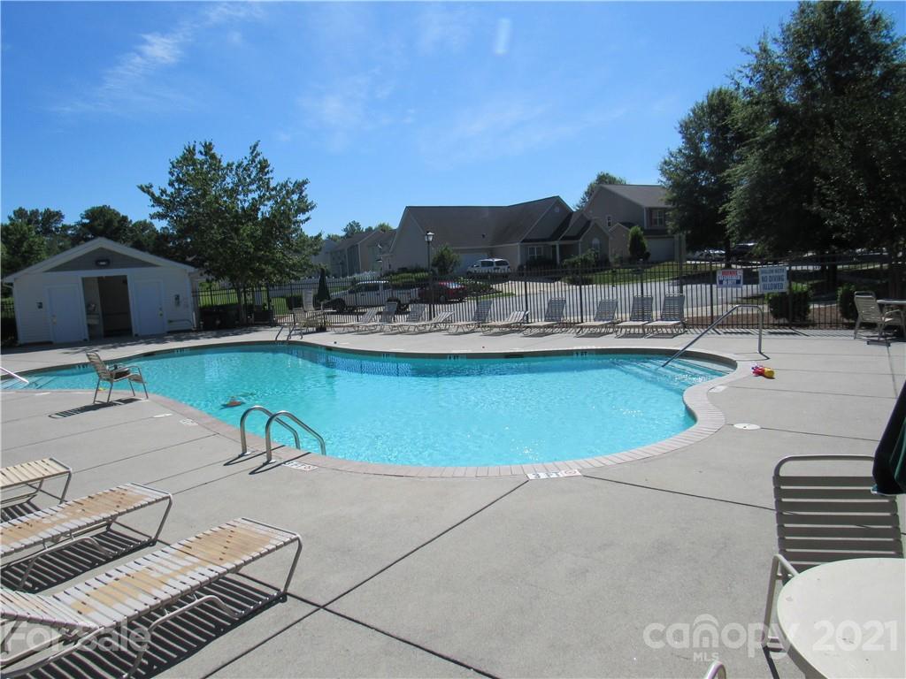 8188 Thornton Street Locust, NC 28097 - Photo 35 of 36 a view of a swimming pool with lounge chairs