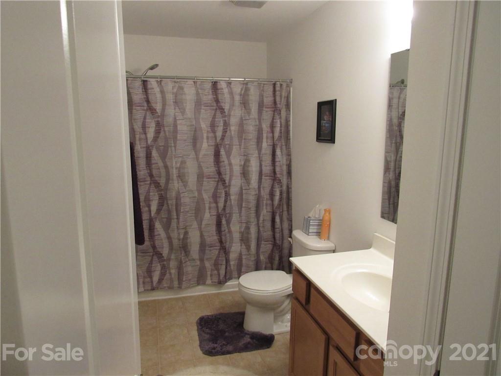 8188 Thornton Street Locust, NC 28097 - Photo 8 of 36 a bathroom with a sink toilet and shower