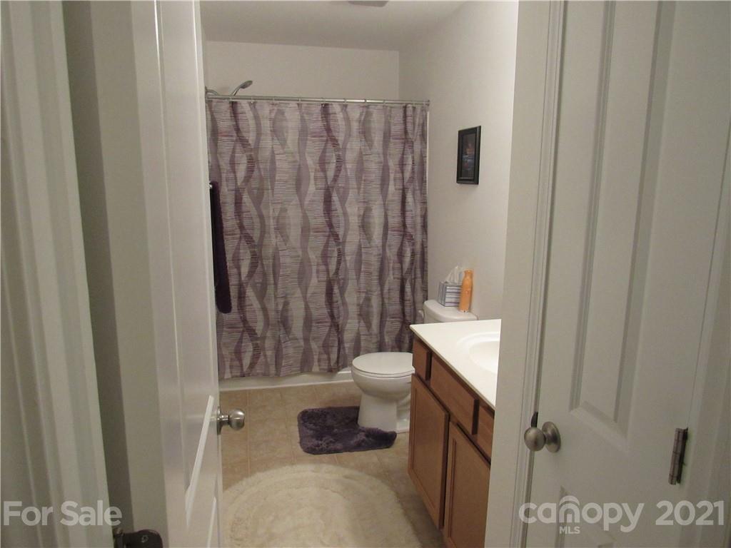 8188 Thornton Street Locust, NC 28097 - Photo 9 of 36 a bathroom with a sink toilet and shower