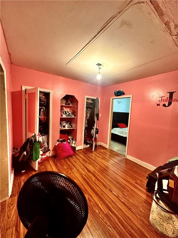 767 Eastern Parkway, Unit 1A Brooklyn, NY 11213 - Photo 2 of 12 a bed room with a bed and a television