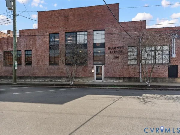 a view of a building with a street