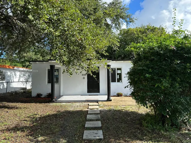 a house with trees in front of it