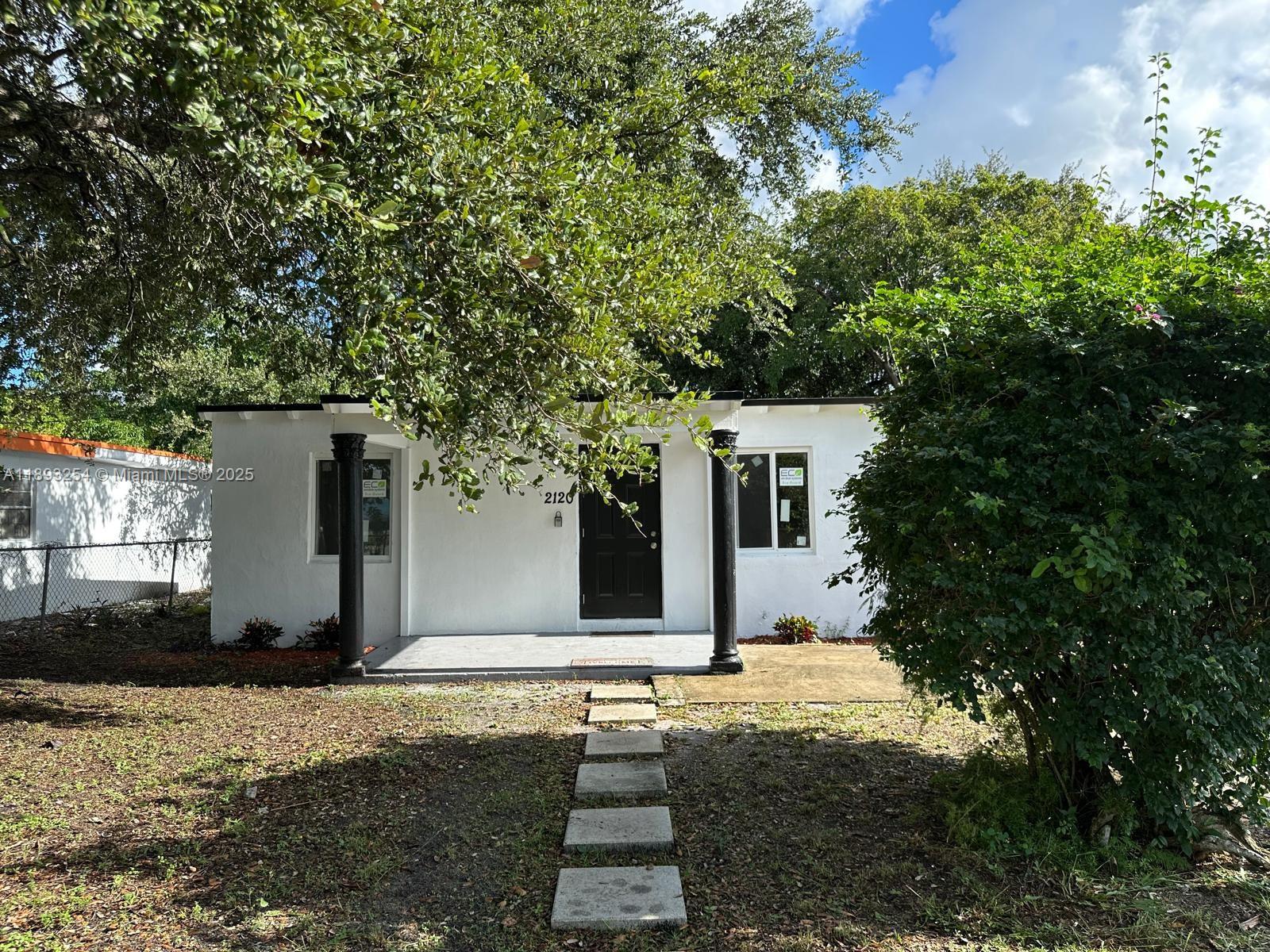 a house with trees in front of it