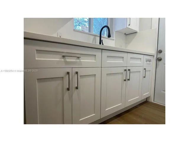 a black and white photo of a sink