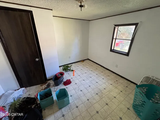 a living room with a couch and a dresser