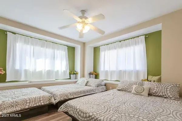 a bedroom with a bed and a chandelier