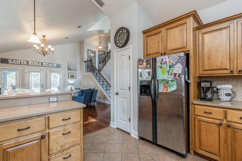 1164 Driftwood Point Road Santa Rosa Beach, FL 32459 - Photo 12 of 39 a kitchen with stainless steel appliances granite countertop a refrigerator and a stove