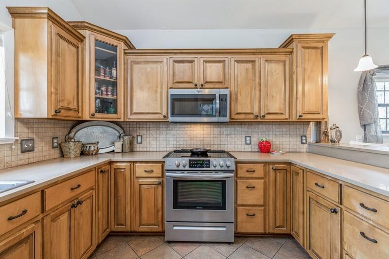 1164 Driftwood Point Road Santa Rosa Beach, FL 32459 - Photo 13 of 39 a kitchen with stainless steel appliances granite countertop white cabinets a sink and a stove