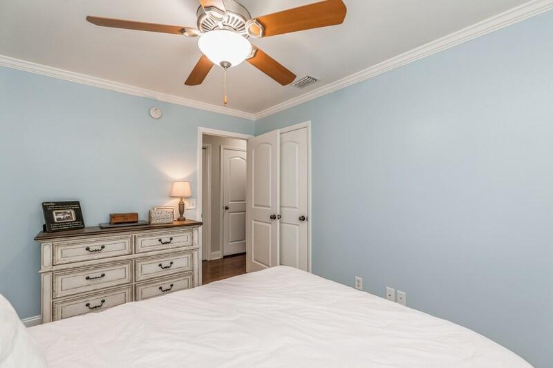 1164 Driftwood Point Road Santa Rosa Beach, FL 32459 - Photo 15 of 39 a bedroom with a bed and a chandelier fan