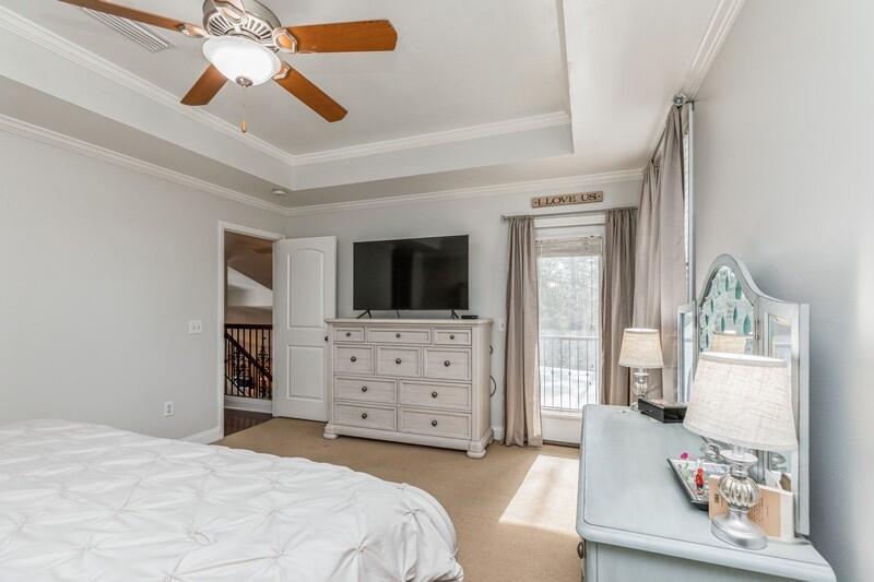 1164 Driftwood Point Road Santa Rosa Beach, FL 32459 - Photo 21 of 39 a bedroom with a bed and a flat screen tv