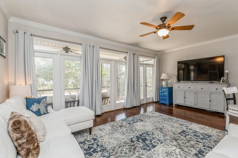 1164 Driftwood Point Road Santa Rosa Beach, FL 32459 - Photo 26 of 39 a living room with a flat screen tv and a window