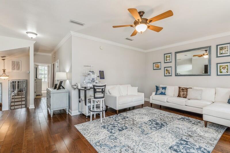 1164 Driftwood Point Road Santa Rosa Beach, FL 32459 - Photo 28 of 39 a living room with furniture and wooden floor
