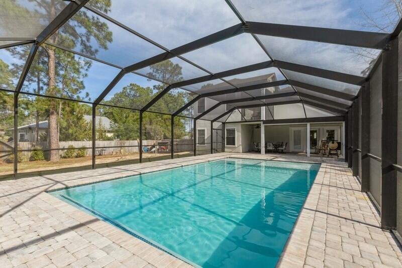 1164 Driftwood Point Road Santa Rosa Beach, FL 32459 - Photo 33 of 39 a view of a backyard with a patio and a yard