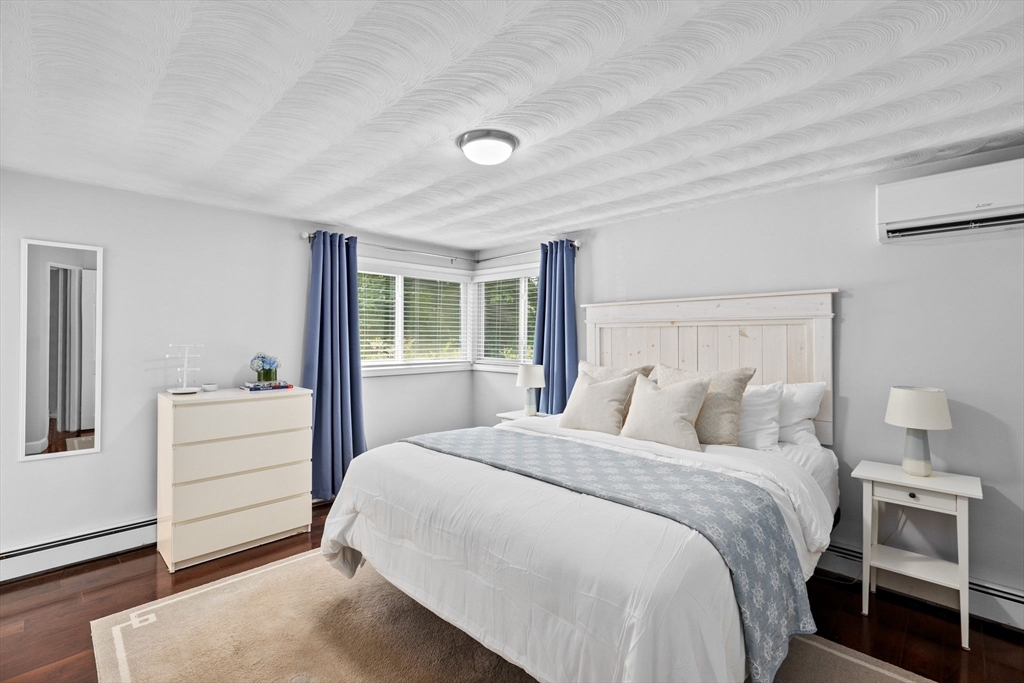 13 Pinewood Drive Framingham, MA 01701 - Photo 12 of 21 a bedroom with a bed and a window