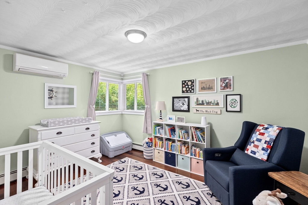 13 Pinewood Drive Framingham, MA 01701 - Photo 15 of 21 a bedroom with furniture and a book shelf
