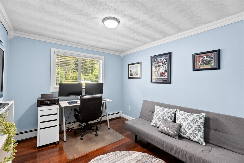 13 Pinewood Drive Framingham, MA 01701 - Photo 17 of 21 a view of a livingroom with workspace and a couch