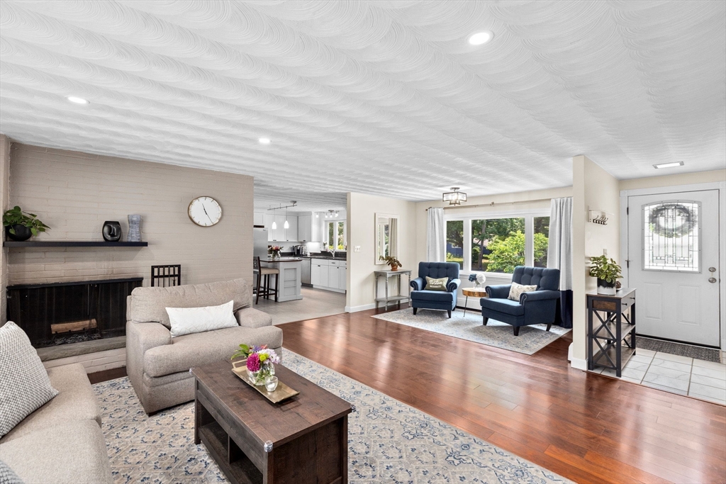 13 Pinewood Drive Framingham, MA 01701 - Photo 2 of 21 a living room with furniture and wooden floor