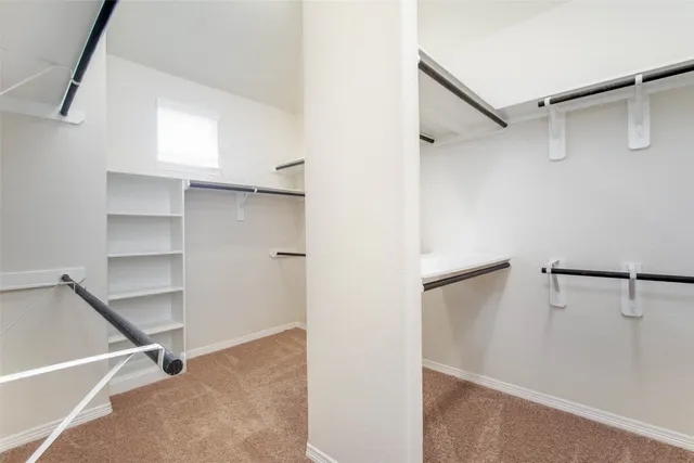 a view of an empty walk in closet