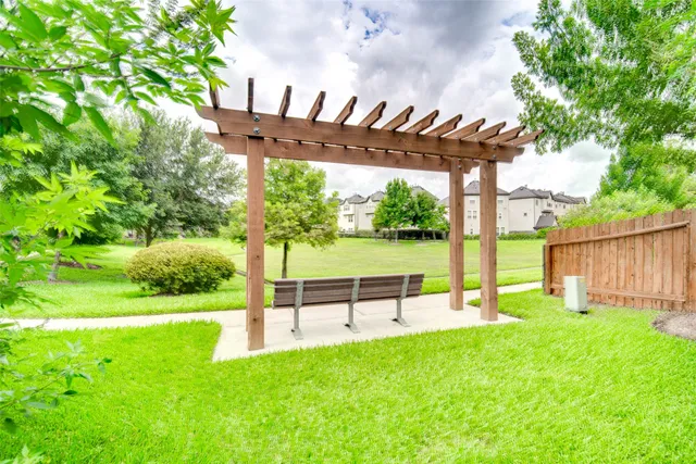 a view of a chair and table in the garden