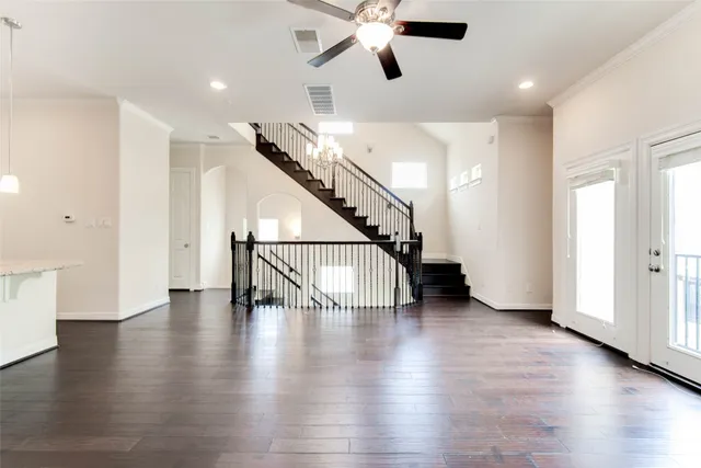 a view of an entryway with wooden floor
