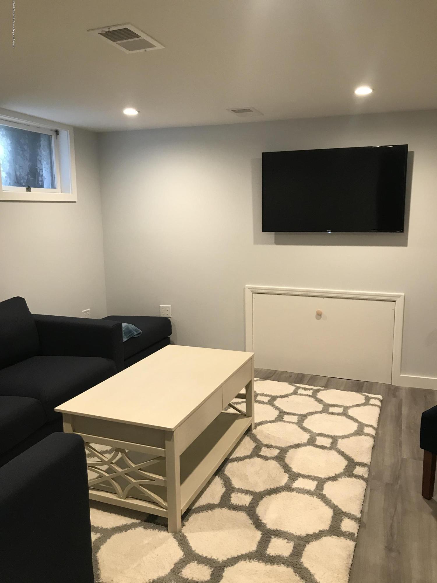 16 Webb Avenue Ocean Grove, NJ 07756 - Photo 13 of 32 a room with a bed and a television