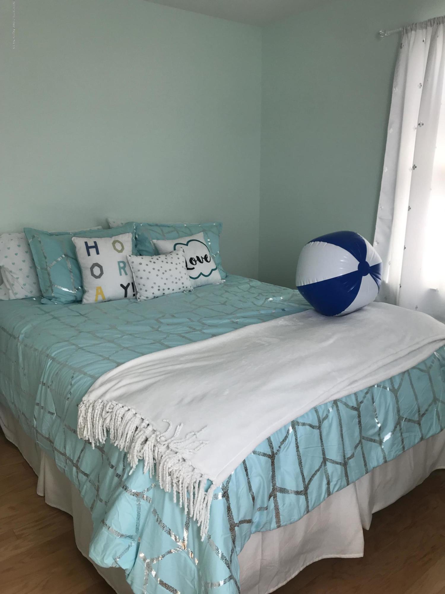 16 Webb Avenue Ocean Grove, NJ 07756 - Photo 17 of 32 a bedroom with a bed and a window