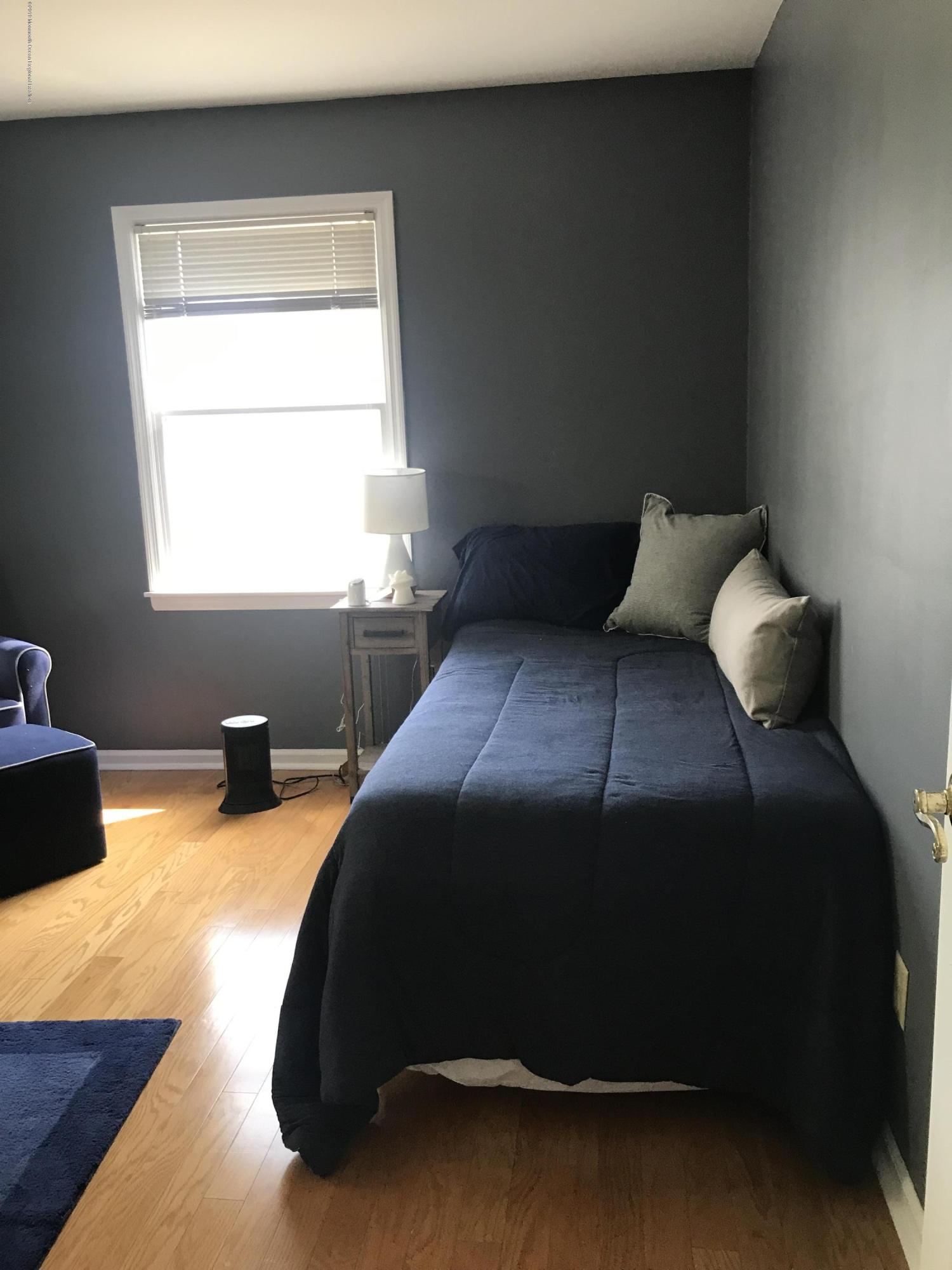 16 Webb Avenue Ocean Grove, NJ 07756 - Photo 18 of 32 a bedroom with a bed and window