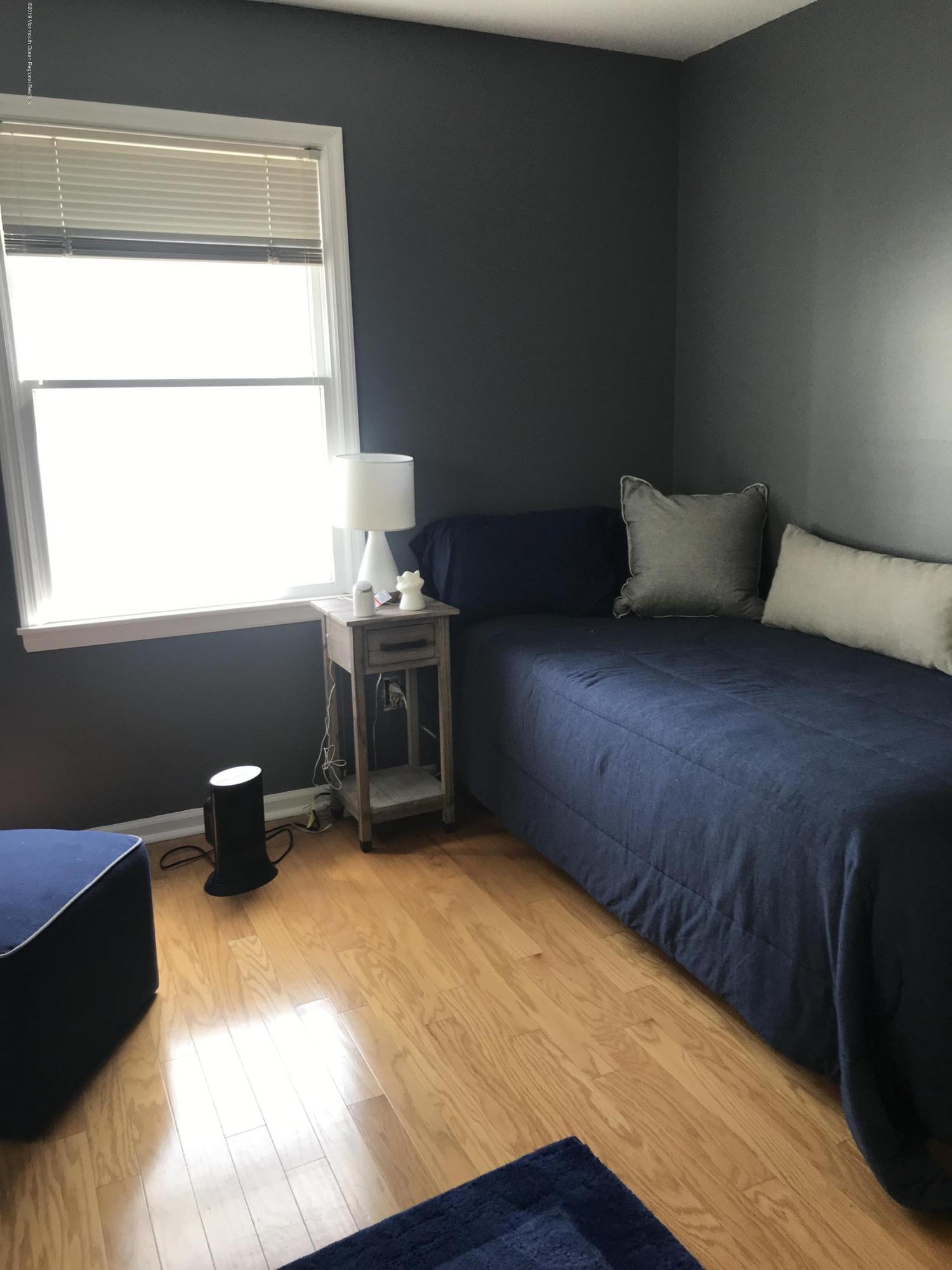 16 Webb Avenue Ocean Grove, NJ 07756 - Photo 19 of 32 a bedroom with a bed and a window