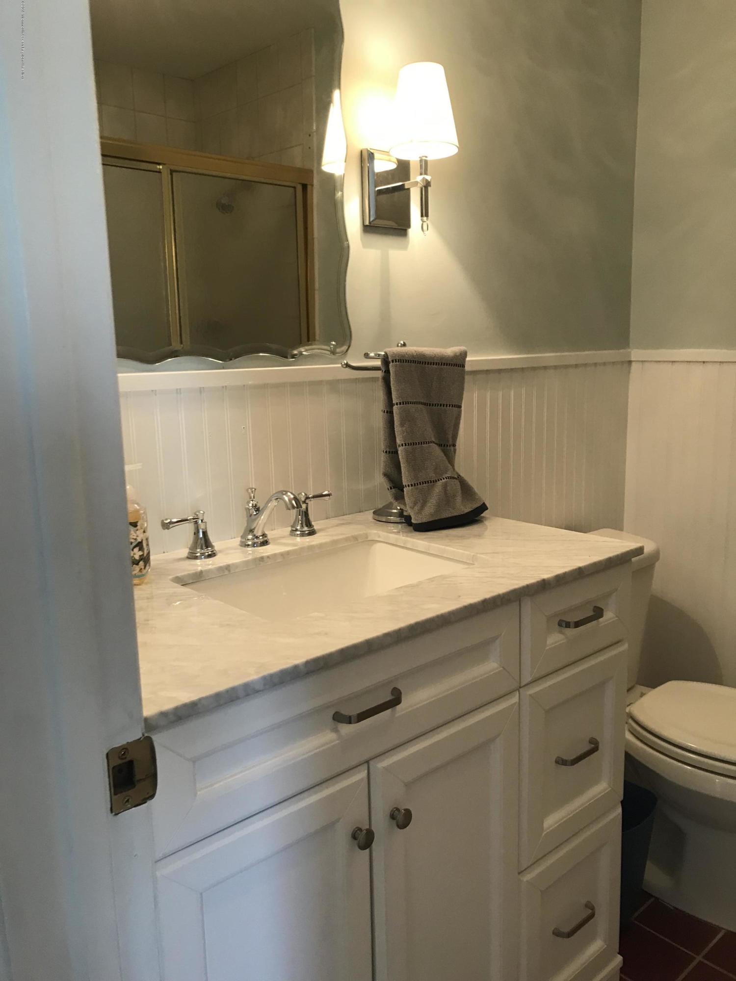 16 Webb Avenue Ocean Grove, NJ 07756 - Photo 20 of 32 a bathroom with a sink and a mirror