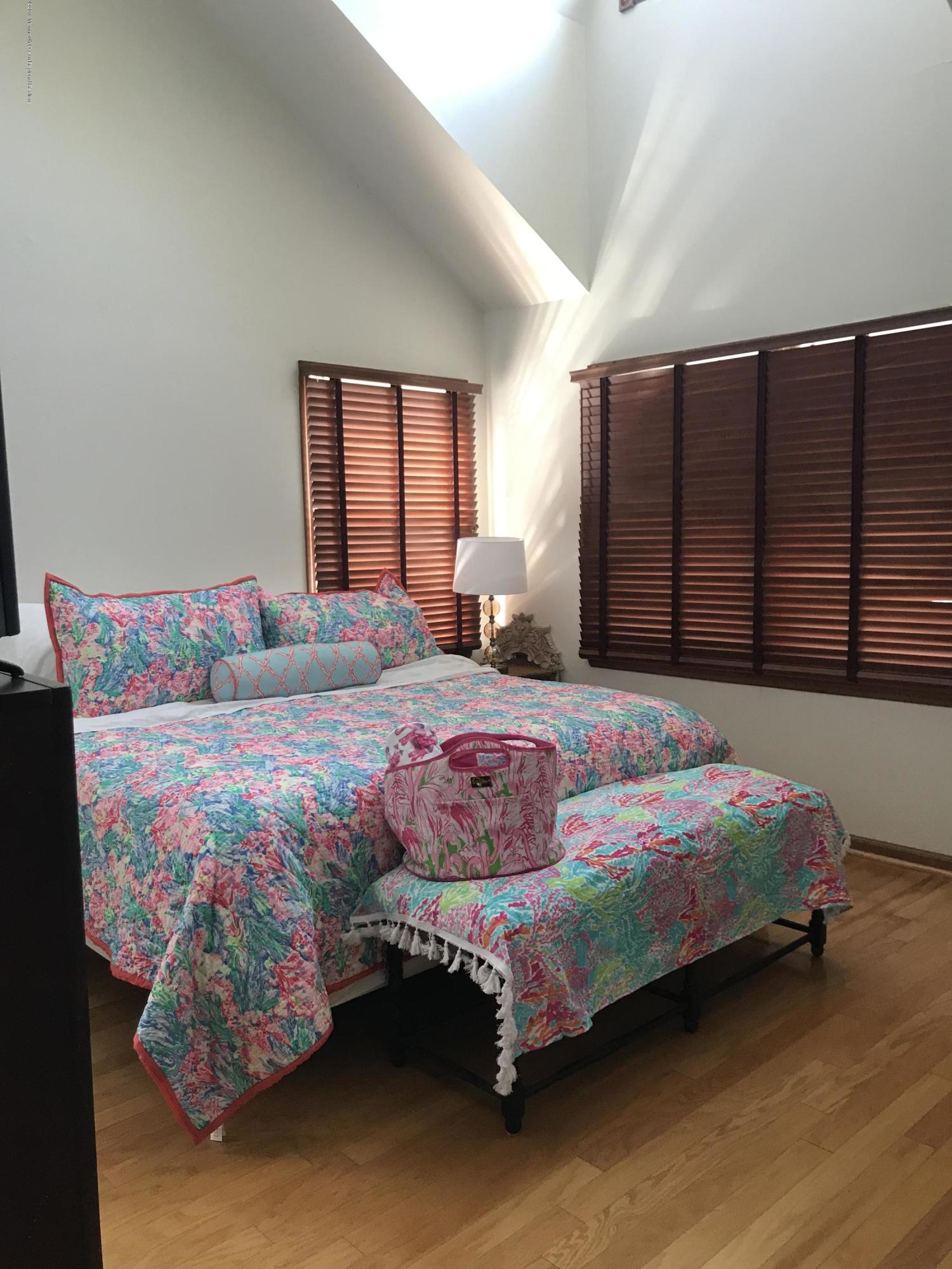 16 Webb Avenue Ocean Grove, NJ 07756 - Photo 23 of 32 a bedroom with a bed painting and a window