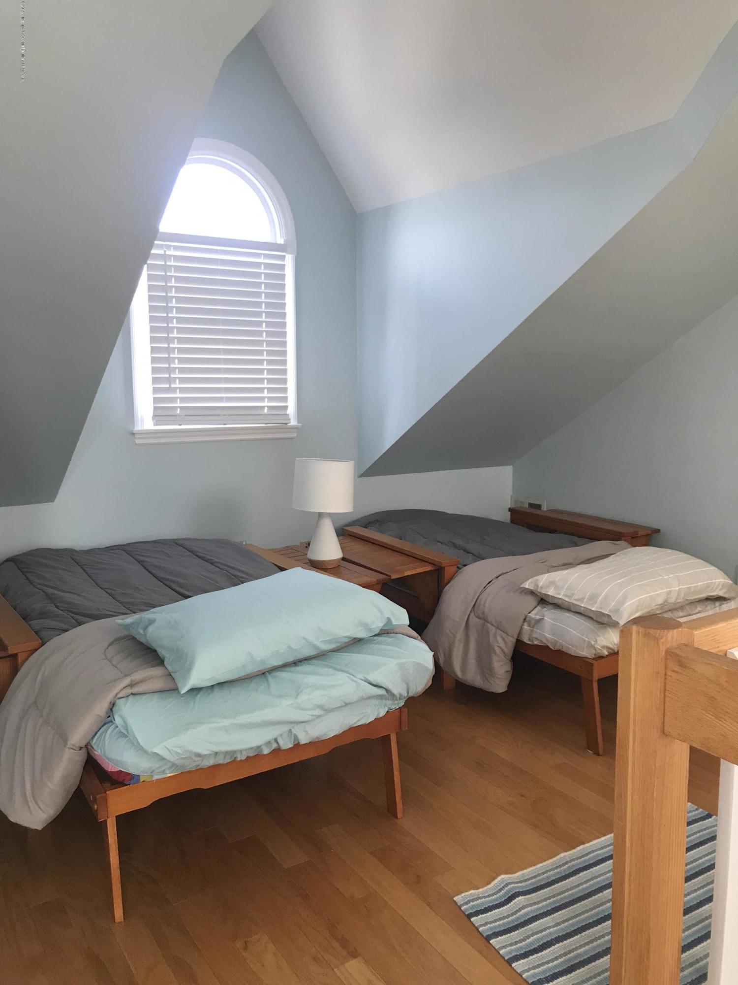 16 Webb Avenue Ocean Grove, NJ 07756 - Photo 28 of 32 a bedroom with two beds and a window
