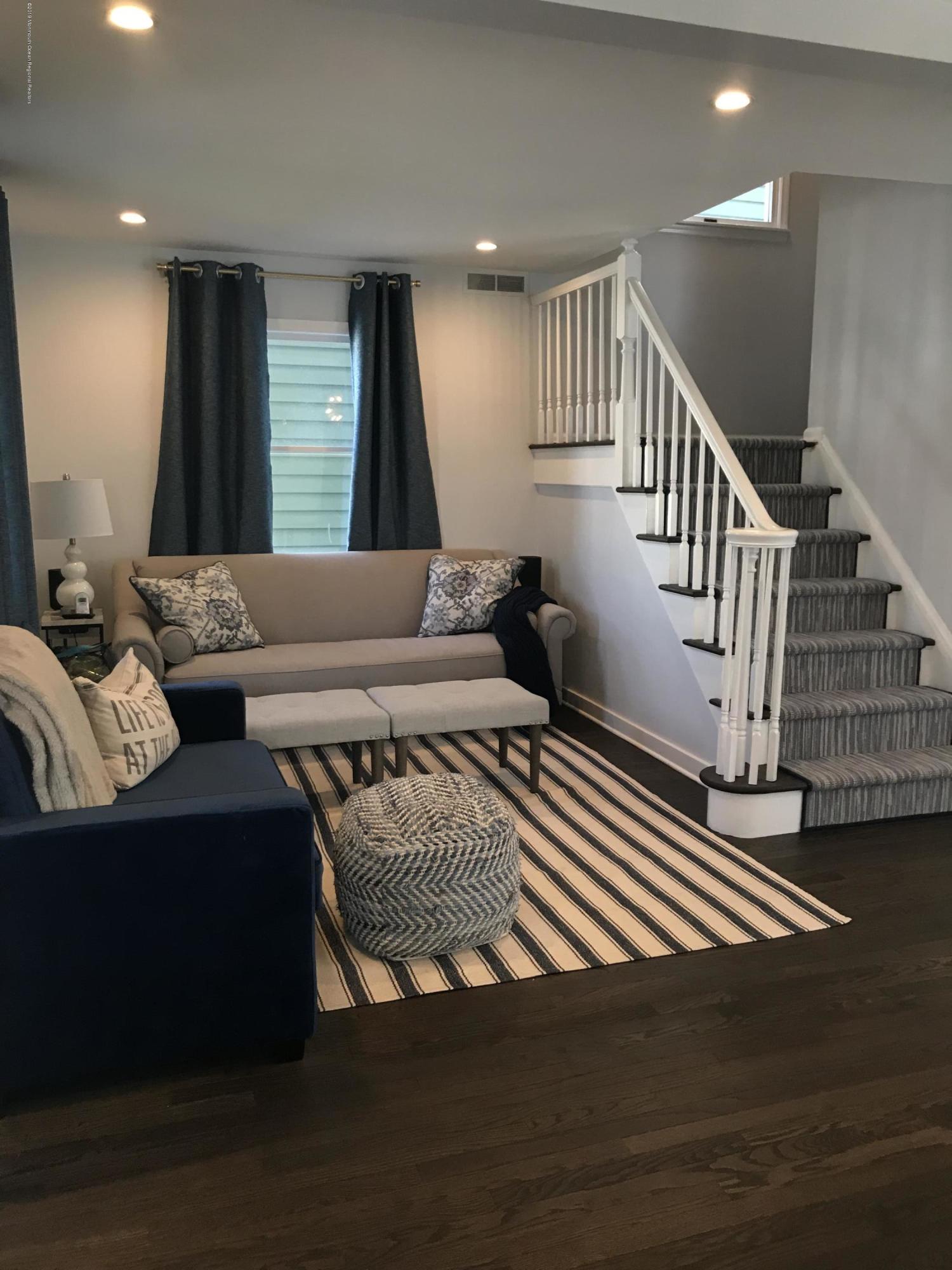 16 Webb Avenue Ocean Grove, NJ 07756 - Photo 4 of 32 a living room with furniture and a table