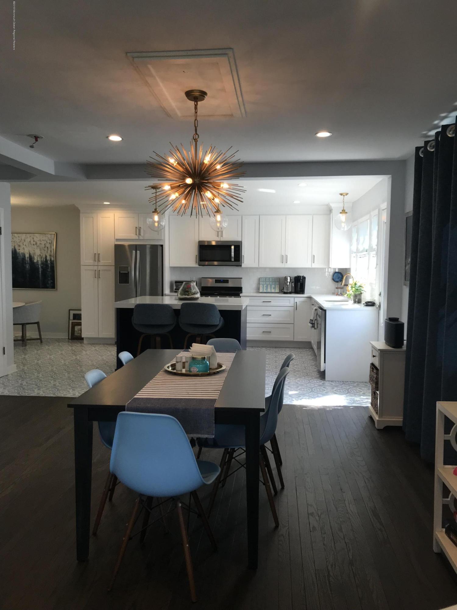16 Webb Avenue Ocean Grove, NJ 07756 - Photo 5 of 32 a view of a dining room with furniture wooden floor and chandelier