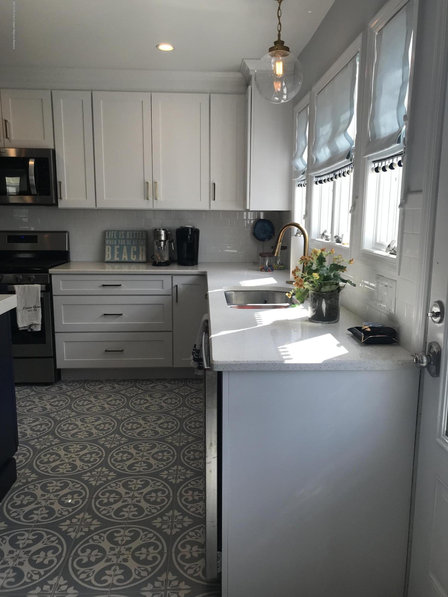 16 Webb Avenue Ocean Grove, NJ 07756 - Photo 8 of 32 a kitchen with a sink cabinets and window