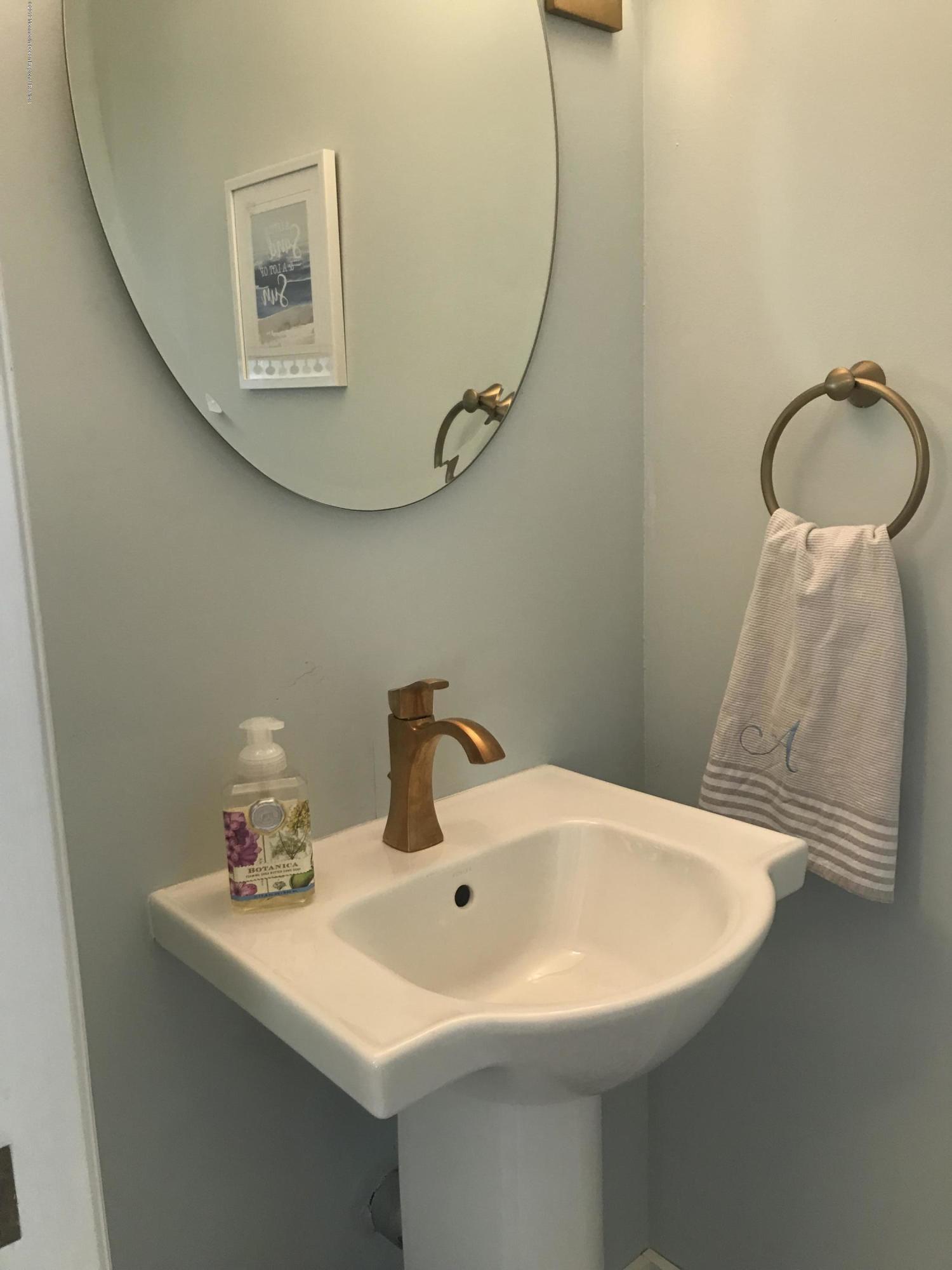 16 Webb Avenue Ocean Grove, NJ 07756 - Photo 10 of 32 a bathroom with a sink and mirror