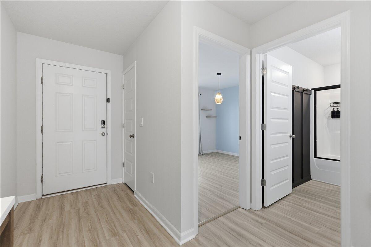 943 Sandbar Loop Crestview, FL 32539 - Photo 6 of 59 a view of hallway with wooden floor