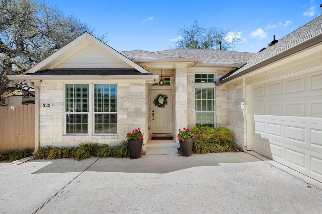 322 River Bluff Circle Georgetown, TX 78626 - Photo 1 of 35 a front view of a house with garden