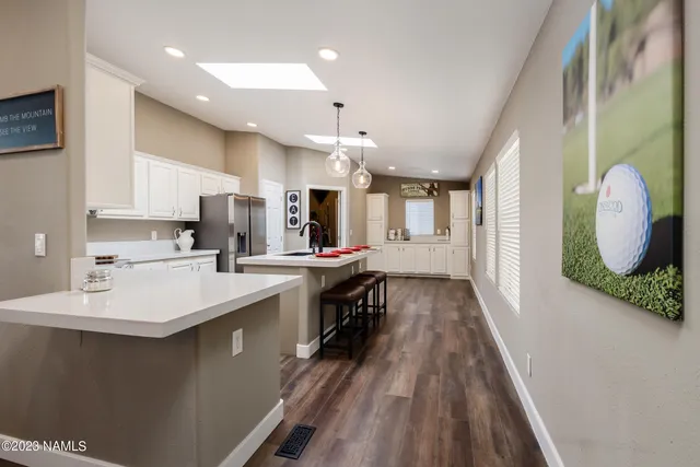 a view of a patio with a table chairs and backyard