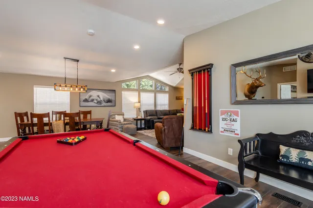 a view of swimming pool with outdoor seating