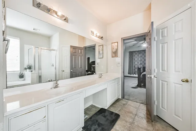 a bedroom with a bed and a desk